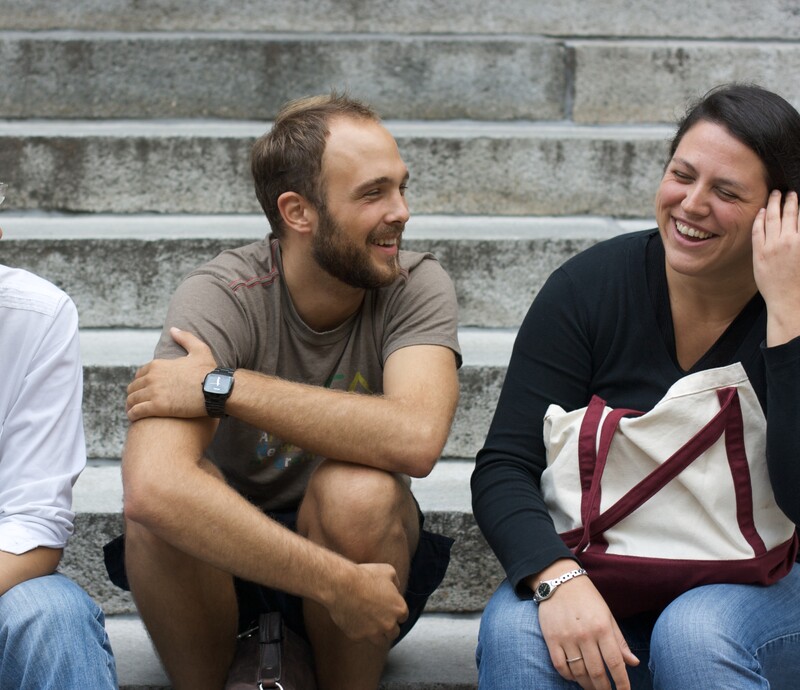 Three international students on steps of Widener Library